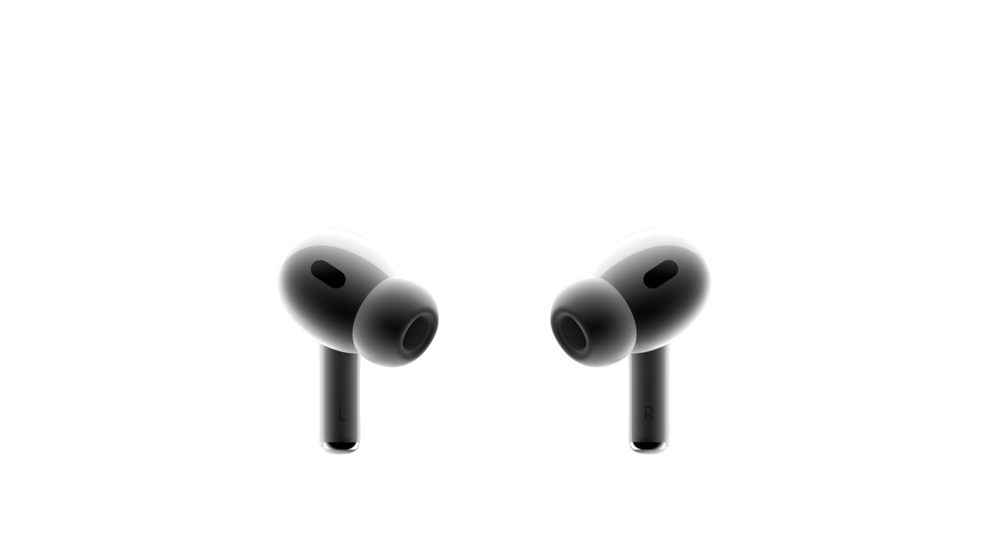 两只白色 AirPods Pro 耳机彼此相对。两边都配有黑色网罩的小巧耳机，安装着硅胶耳塞。