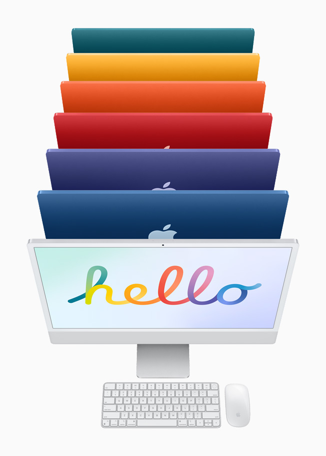 银色 iMac 与相同颜色的妙控键盘与妙控鼠标，后面是 6 种颜色的 iMac。