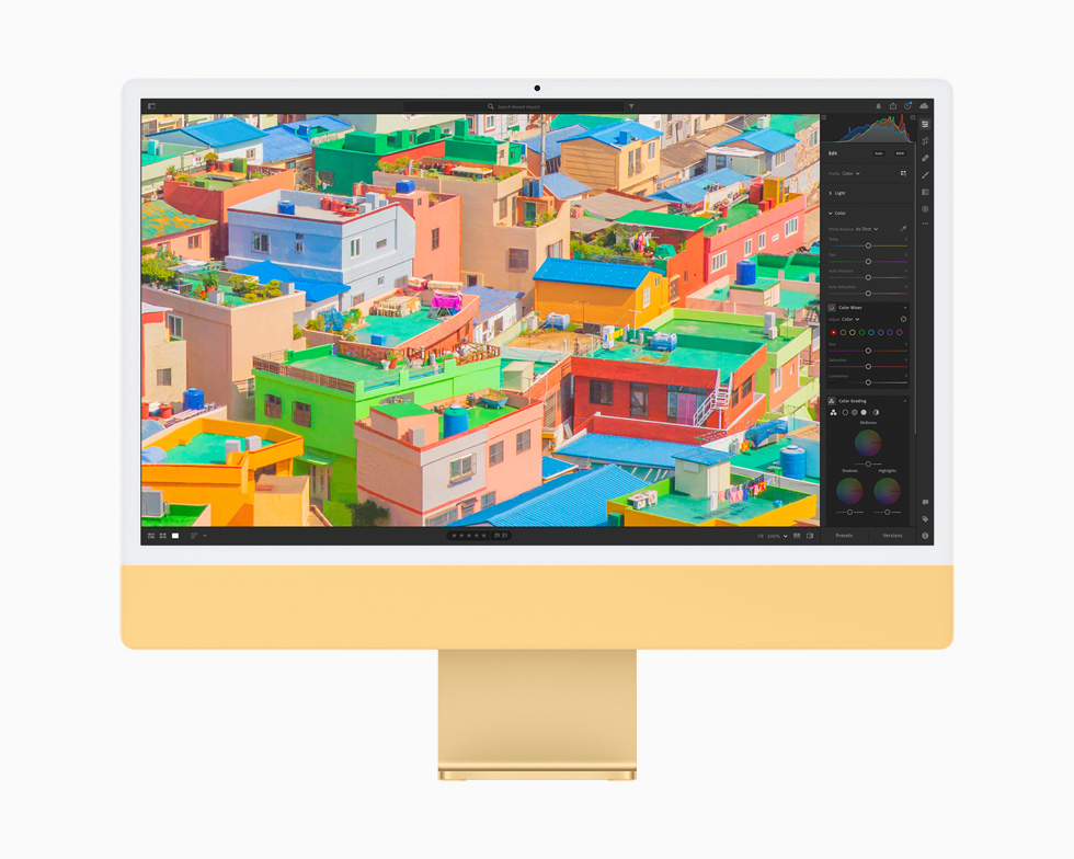 在一台黄色的 iMac 上，照片 app 正在编辑照片。