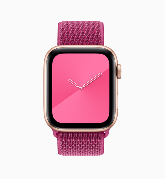 Apple Watch 粉红色回环形表带与表盘。
