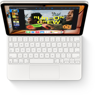 iPad Air 与白色妙控键盘相连的俯视图。
