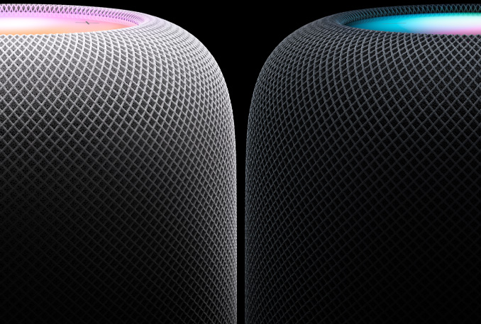  One white and one midnight HomePod are placed side by side.